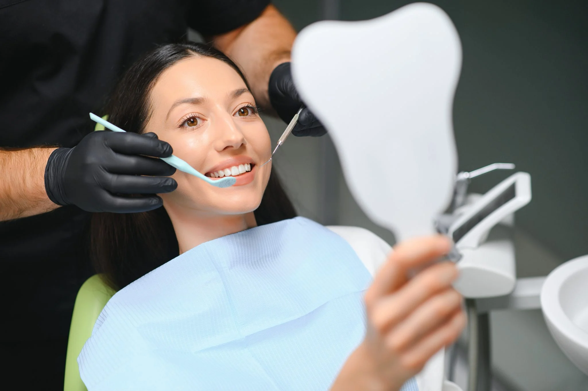 Dentist examining patients teeth close up